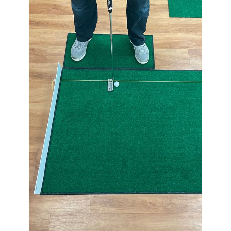 Big Moss Golf Michael Breed's "Let's Do This!" Training Green with a golfer putting.