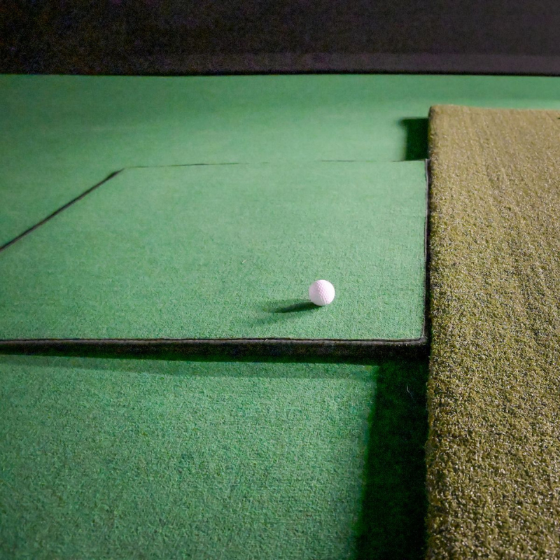 Big Moss Return Ramp with golf ball and hitting mat.