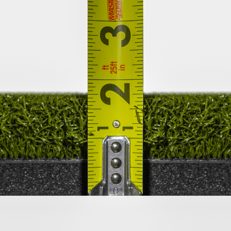 Carl's Place HotShot Golf Hitting Mat with measuring tape.