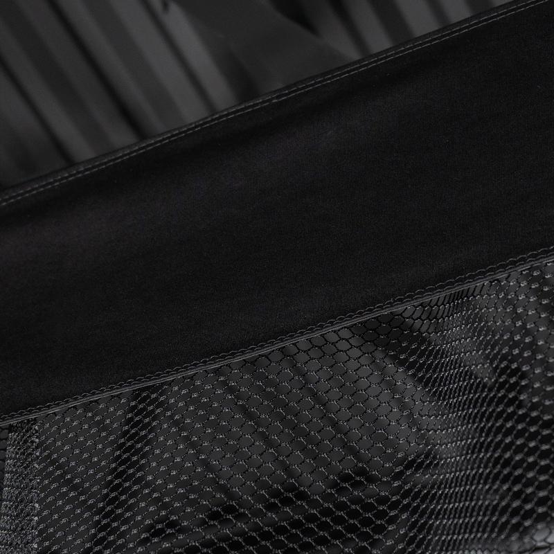 Carls Place Golf Room Netting closeup of black valence above mesh netting.