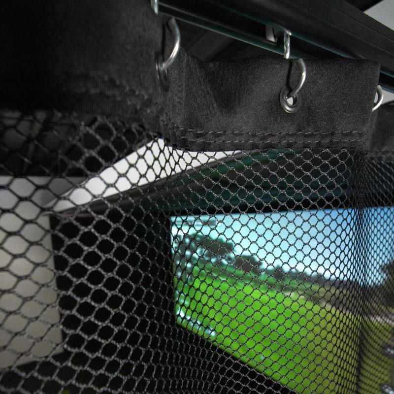 Carls Place Golf Room Netting interior view through black mesh netting showing golf simulator screen.