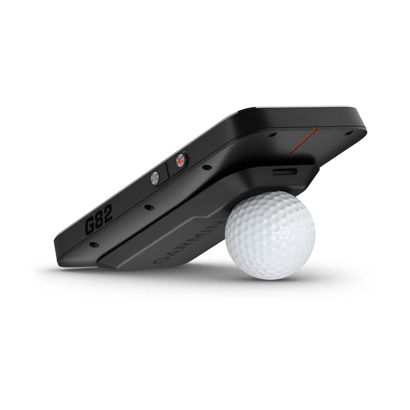 Garmin Approach® G82 GPS Golf Handheld and Launch Monitor lying on a golf ball.