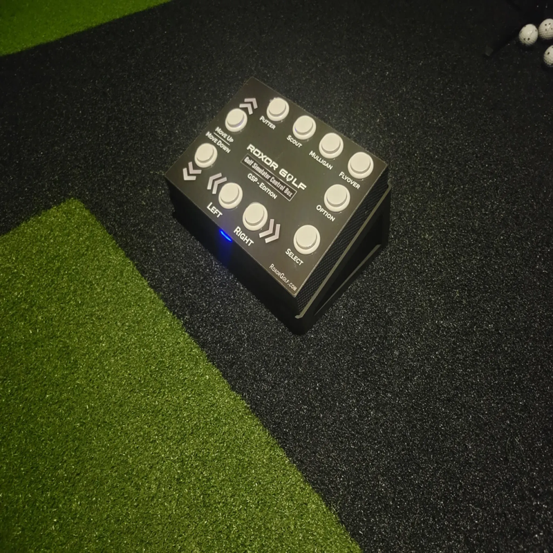 Roxor Golf Control Box GSP-TB Edition top view of control box on turf with all buttons visible blue indicator light.