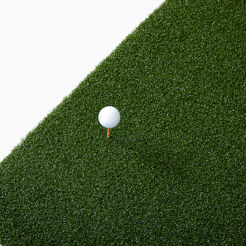 SkyTrak 5x5 Hitting Mat with golf ball and tee.