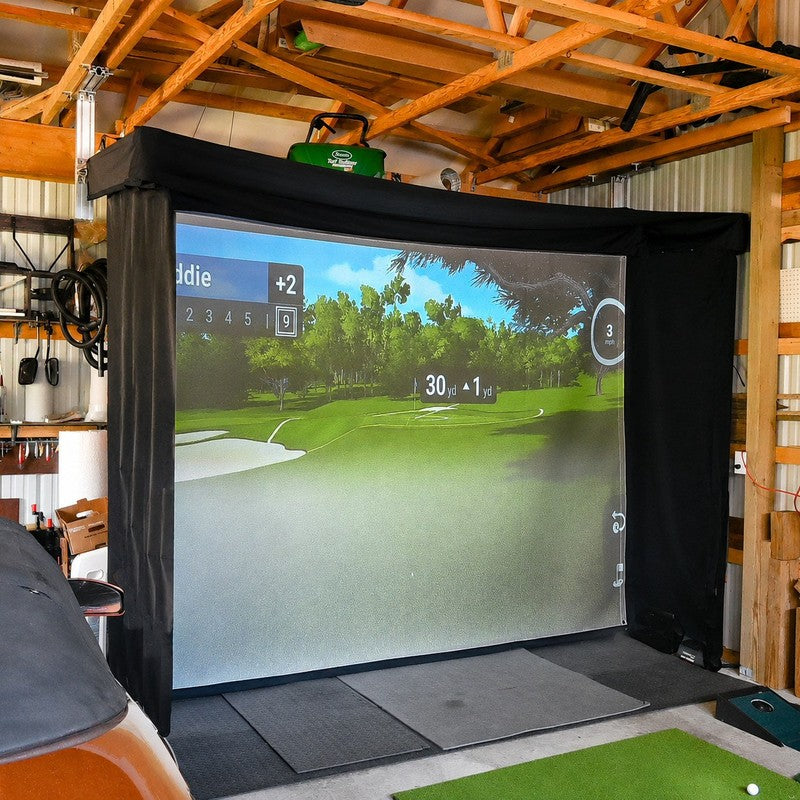 The SportsScreen Vanish LITE Series Golf Simulator Enclosure ceiling mounted in a workshop golf bay.
